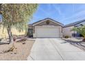 House exterior showcasing a two-car garage and desert landscaping at 24191 N Desert Dr, Florence, AZ 85132