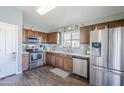 Modern kitchen with stainless steel appliances and wood cabinets at 24191 N Desert Dr, Florence, AZ 85132