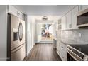 Bright kitchen featuring a breakfast nook and updated cabinetry at 2571 N Miller Rd, Scottsdale, AZ 85257