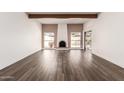 Spacious living room with fireplace and wood-look flooring at 2571 N Miller Rd, Scottsdale, AZ 85257