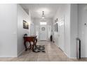 Bright and spacious entryway with tile flooring and a wooden console table at 2702 S Joplin --, Mesa, AZ 85209