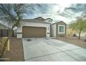 Charming single-story home with a two-car garage and low maintenance desert landscaping at 30263 W Pinchot Ave, Buckeye, AZ 85396