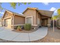 Charming single-story home with a two-car garage and well-maintained front yard landscaping at 3102 W Louise Dr, Phoenix, AZ 85027