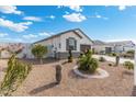 Charming home with drought-tolerant landscaping and a two-car garage at 3560 N Mia Ln, Casa Grande, AZ 85122