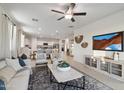 Open living room featuring neutral colors and a modern aesthetic at 36060 W San Ildefanso Ave, Maricopa, AZ 85138