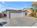 Cute one-story home with a two-car garage and landscaped yard at 40440 N High Meadows Dr, San Tan Valley, AZ 85140