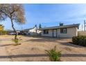 House exterior showcasing landscaping and a residential street at 4263 W Morten Ave, Phoenix, AZ 85051