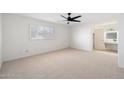 Spacious bedroom with plush carpeting and ceiling fan at 4316 N Parkway Ave, Scottsdale, AZ 85251