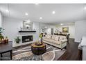 Bright living room featuring a fireplace and hardwood floors at 4501 E Calle Redonda --, Phoenix, AZ 85018