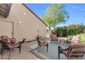 Inviting outdoor patio with seating area, a neutral rug, and access to greenery at 11129 N 109Th St, Scottsdale, AZ 85259