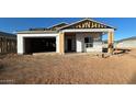 Unfinished home exterior with exposed framing and roofing at 11438 E Utopia Ave, Mesa, AZ 85212