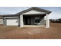 Charming single-story home featuring a covered entryway and attached garage at 11438 E Utopia Ave, Mesa, AZ 85212