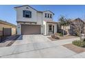 Two-story house with a brown garage door and landscaped yard at 13184 N 144Th Ln, Surprise, AZ 85379