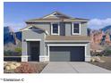 Two-story house with gray siding, a two-car garage, and a landscaped front yard at 1707 W Sheridan Ave, Apache Junction, AZ 85117