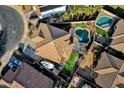 Aerial view of house, pool, and neighborhood at 18651 E Superstition Dr, Queen Creek, AZ 85142