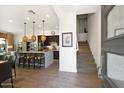 Bright and airy entryway with view of kitchen and staircase at 23393 N 73Rd Way, Scottsdale, AZ 85255