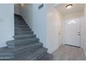 Entryway featuring tiled flooring and a staircase leading to the upper level at 235 N 22Nd Pl # 565, Mesa, AZ 85213