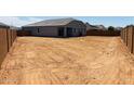 Expansive backyard, ideal for outdoor activities, awaiting landscaping to create your private oasis at 28242 N Nealite Dr, San Tan Valley, AZ 85143