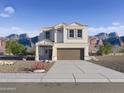 Two-story house with brown garage door and desert landscaping at 5099 E Umber Rd, San Tan Valley, AZ 85143