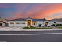 Lovely Spanish style home with a three-car garage and desert landscaping at 5635 W Melinda Ln, Glendale, AZ 85308