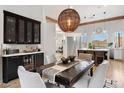 Elegant dining area with a rustic table and mountain views at 8150 N 47Th St, Paradise Valley, AZ 85253