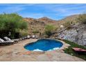 Inviting kidney-shaped pool with mountain backdrop at 8150 N 47Th St, Paradise Valley, AZ 85253