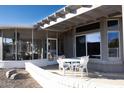 Relaxing outdoor patio space with seating and a pergola at 13709 W Gunsight Dr, Sun City West, AZ 85375