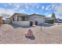 Charming single-story home features a well-maintained front yard, and a two-car garage at 1885 E Sycamore E Rd, Casa Grande, AZ 85122