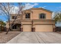 Charming two-story home boasts a spacious driveway, well-kept yard, and a two-car garage at 23000 W Kimberly Dr, Buckeye, AZ 85326