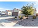 House exterior with a brown garage door and gravel landscaping at 2303 N General Dr, Florence, AZ 85132