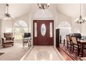 Inviting foyer with high ceilings, decorative tile flooring, and a grand chandelier at 2702 E Vaughn Ave, Gilbert, AZ 85234