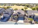 A bird's-eye view showcasing the home's tile roof, landscaping, and proximity to a greenbelt at 3055 N Red Mtn # 156, Mesa, AZ 85207