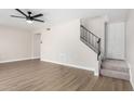 Spacious living area with hardwood floors and a staircase at 4432 E Belleview St, Phoenix, AZ 85008