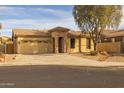 Single-story home with a two-car garage and landscaped front yard at 6238 W Buckhorn Trl, Phoenix, AZ 85083