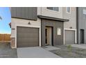 Townhome exterior showcasing garage and entryway at 7563 W Donner Dr, Laveen, AZ 85339