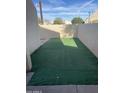 Small backyard with artificial turf and concrete patio at 8883 N 48Th Dr, Glendale, AZ 85302