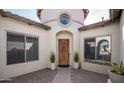 Inviting courtyard showcasing the front door, two windows and a decorative tower element at 1723 W Brianna Rd, Phoenix, AZ 85085