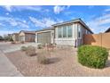 Beautiful single-story home featuring a two-car garage and desert landscaping at 346 E Tahiti E Dr, Casa Grande, AZ 85122