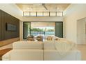 Inviting living room with backyard views through sliding glass doors to a pool at 3643 E Coolidge St, Phoenix, AZ 85018