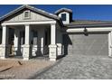 Charming home featuring a gray brick paver driveway, stylish pillars, and modern gray color scheme at 3742 E Rochelle Cir, Mesa, AZ 85213