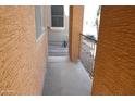 Covered porch featuring textured walls and decorative iron railing at 4114 S Sawmill Rd, Gilbert, AZ 85297