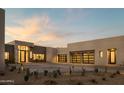 Modern home with a desert landscape, showcasing garage doors at 5327 N Invergordon Rd, Paradise Valley, AZ 85253