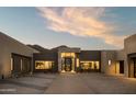 Contemporary desert home with stone accents, neutral colors, and clean lines at 5327 N Invergordon Rd, Paradise Valley, AZ 85253