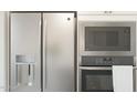 Stainless steel refrigerator, microwave, and wall oven at 564 E Aurora Dr, San Tan Valley, AZ 85140