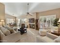 Bright and airy living room featuring a fireplace and comfortable seating at 9041 E Stoney Vista Dr, Sun Lakes, AZ 85248