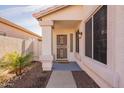 Front door entry with a security door and a welcoming mat at 11057 W Tonto Ln, Peoria, AZ 85373