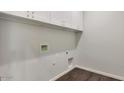 Laundry room with white cabinets and vinyl flooring at 1238 S 14Th St, Phoenix, AZ 85034