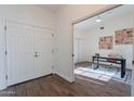 Home office with wood-look floors and built-in shelving at 1326 E Clearwater Ln, Gilbert, AZ 85234