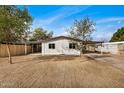 Front view of a remodeled single-story home with a carport at 136 S 90Th Pl, Mesa, AZ 85208