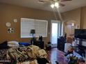 Main bedroom with wood floors and access to patio at 1718 W Colter St # 170, Phoenix, AZ 85015